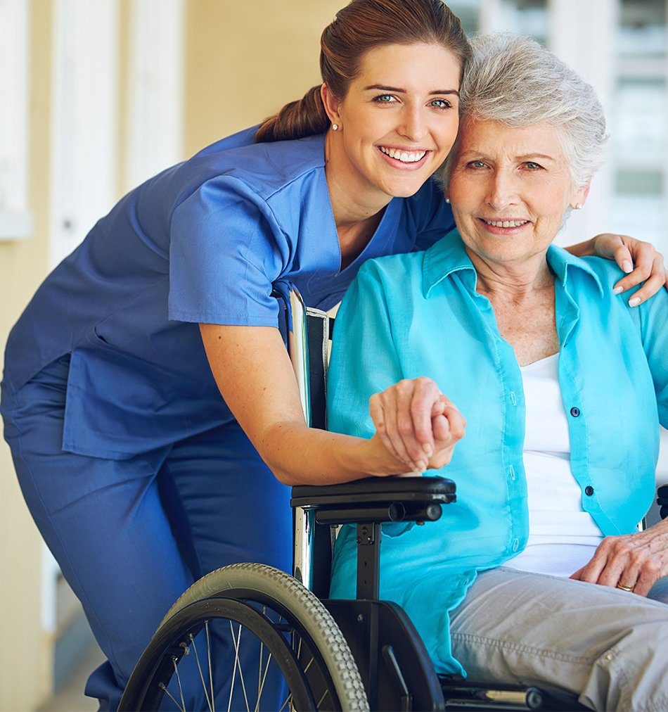 A caregiver sharing a warm moment with an older adult at home